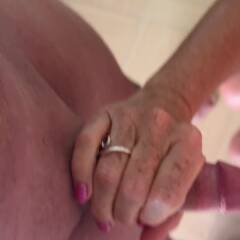 Being stroked over her tits.